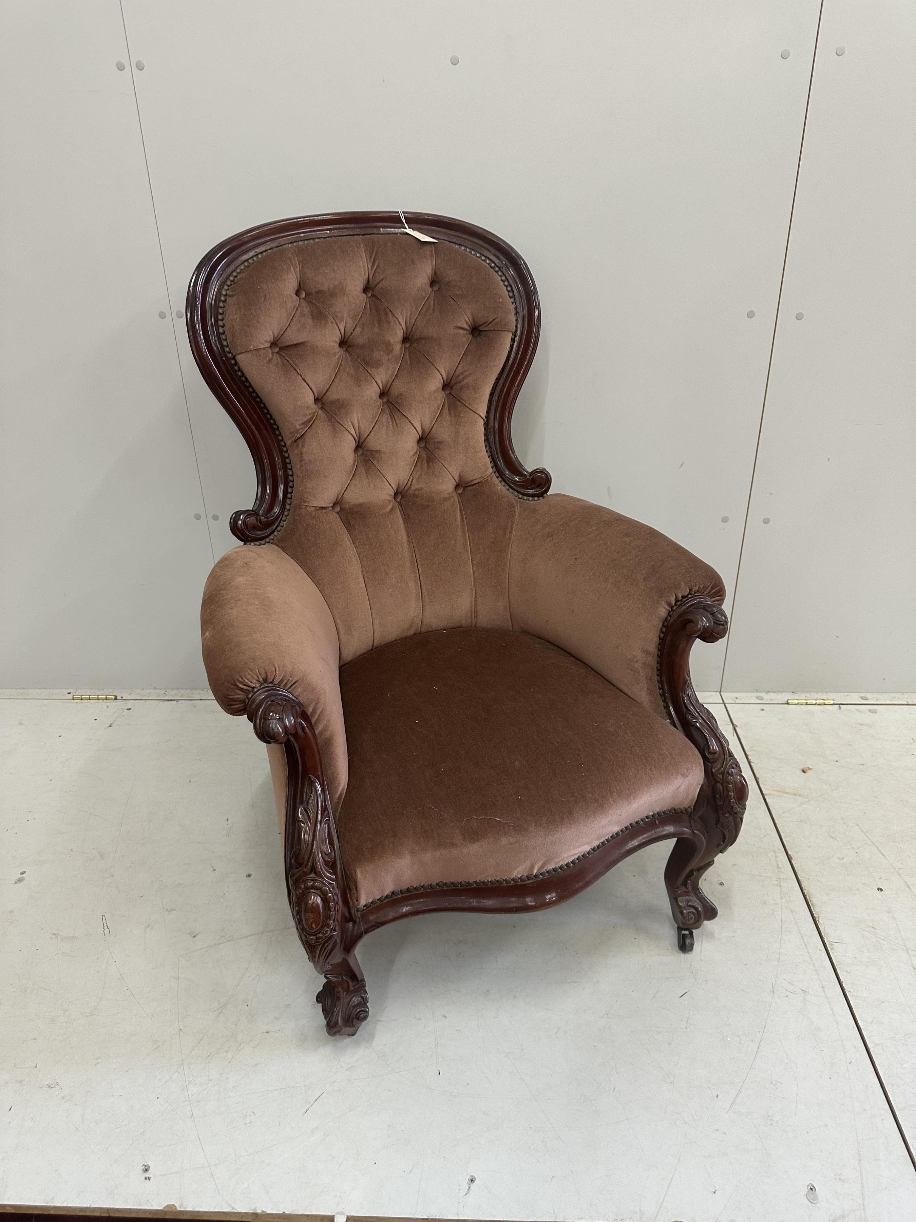 A Victorian upholstered mahogany spoonback armchair, width 80cm, depth 70cm, height 108cm. Condition - fair